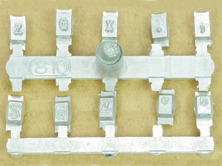 22810 Marca de ceca CARACTERES, OCR, STD GOTHIC, RELIEVE, Z Q X . , , P&D   